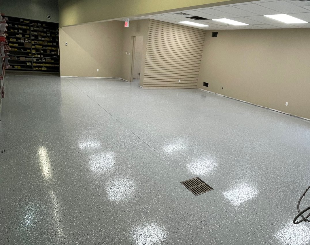 Flaked gray epoxy flooring installed in a Scarborough commercial building