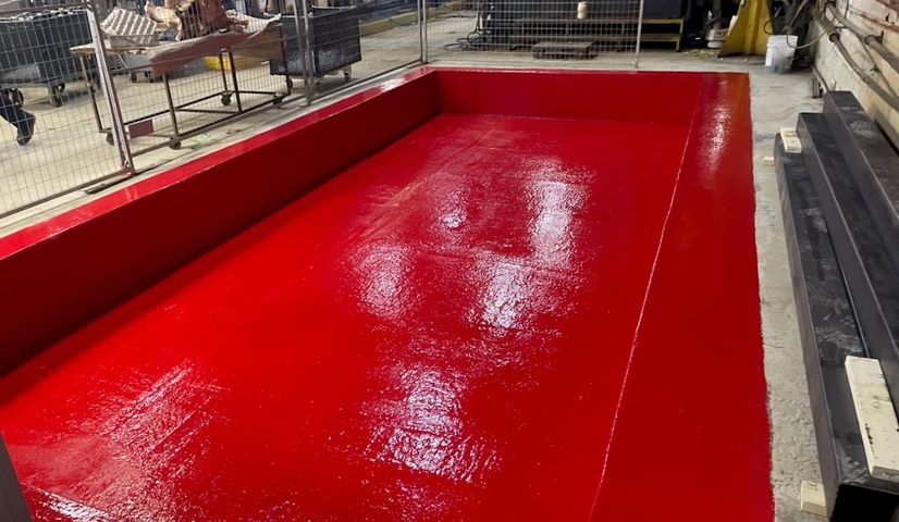 Red epoxy coating in containment tank