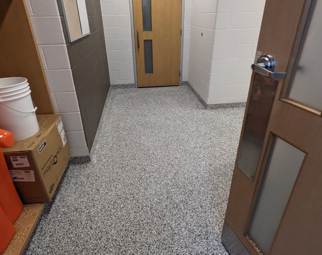 Decorative gray epoxy flooring installed in a Toronto community centre and office space