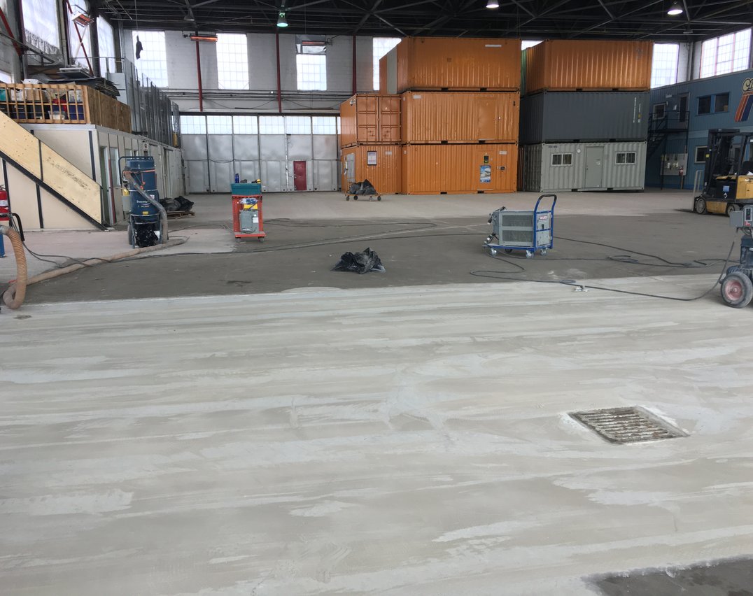 Concrete surface preparation for epoxy flooring installation in Toronto facility
