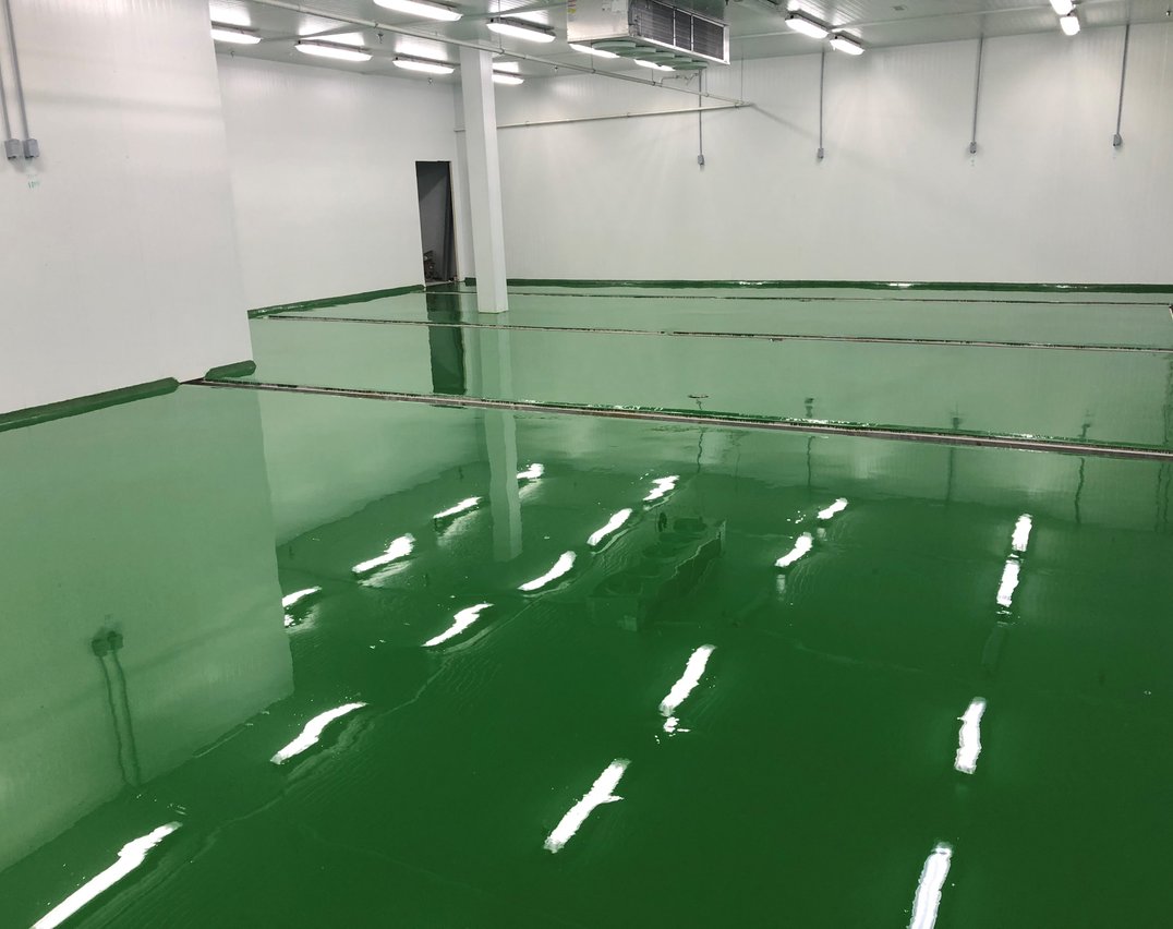 Green epoxy flooring installed in a Toronto food and beverage processing facility