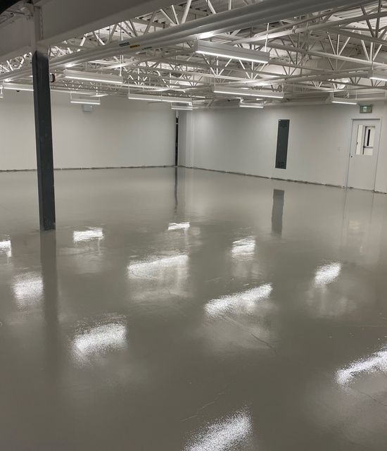 Industrial facility in Toronto cracked and dull green floors