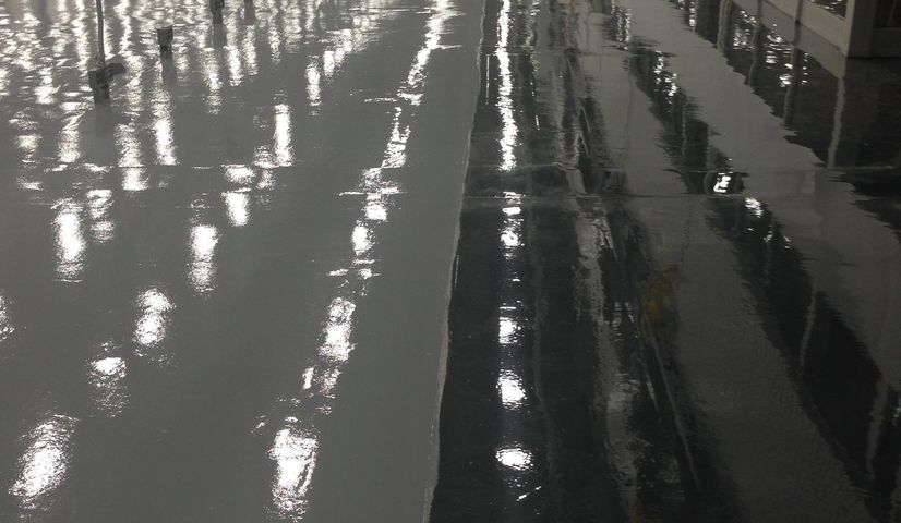 Gray and black epoxy flooring in Toronto industrial warehouse