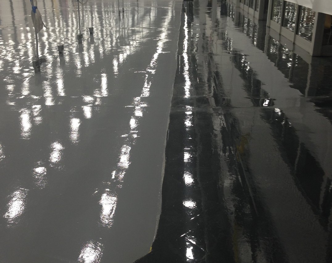 Gray and black epoxy flooring in an Etobicoke west Toronto warehouse