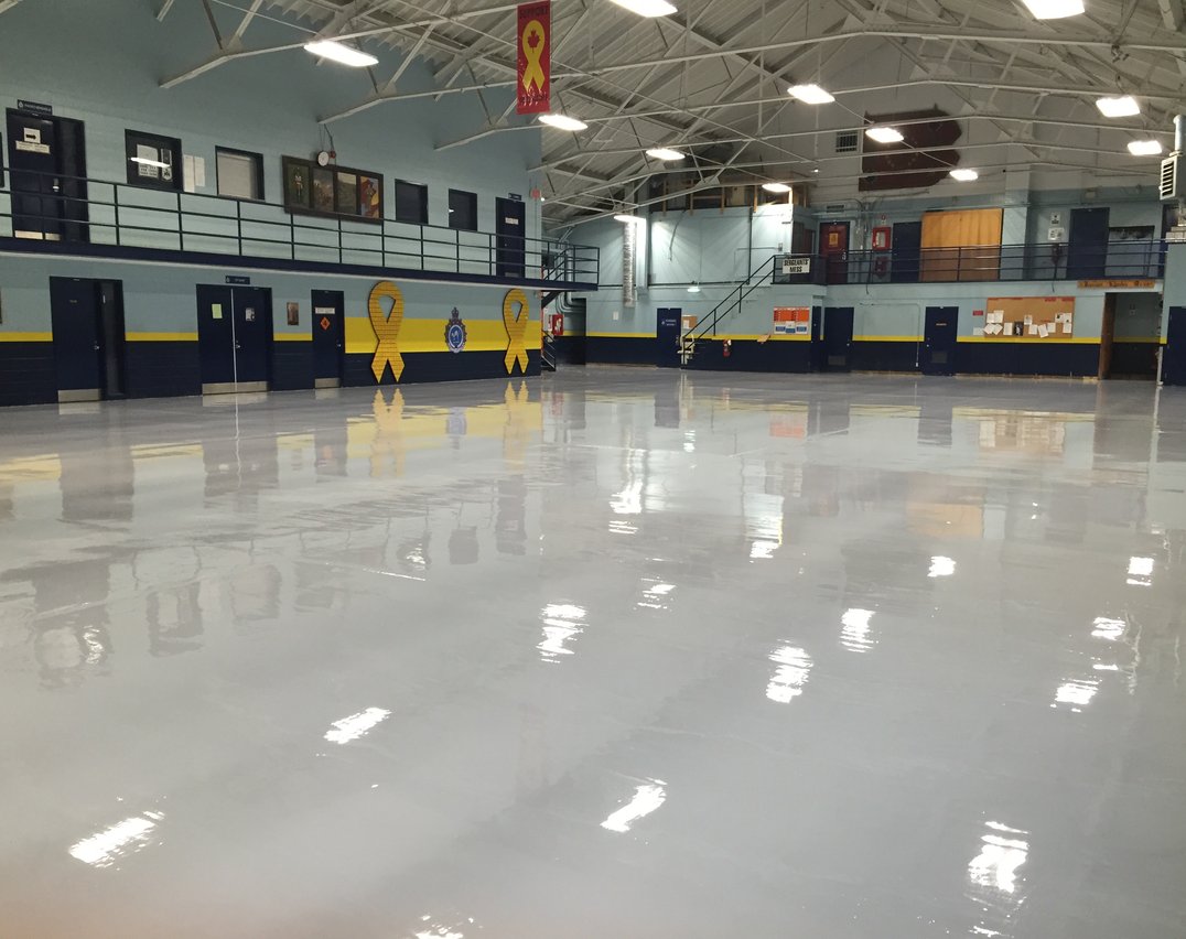 Gray epoxy flooring in a large Toronto industrial manufacturing facility