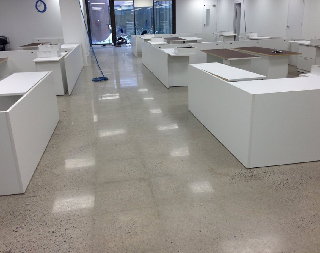 Polished concrete floors in a Toronto office building — high-gloss professional finish