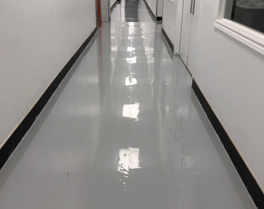 Gray epoxy hallway flooring in a Scarborough commercial office building
