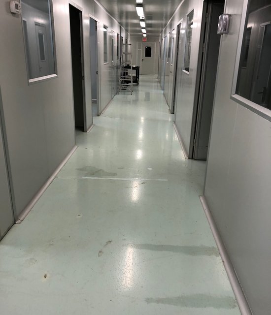 Commercial building hallway in Toronto broken concrete