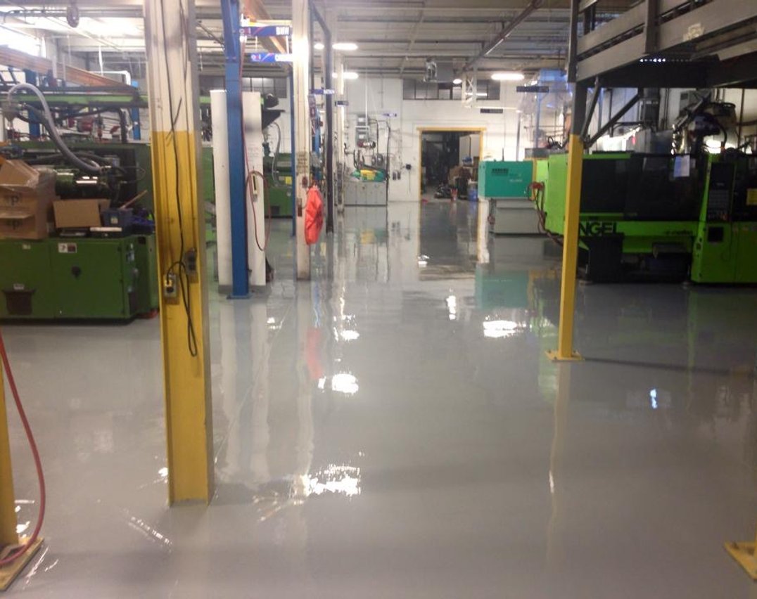 Gray epoxy flooring installed in an Etobicoke industrial warehouse