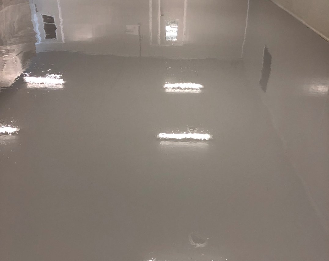 Gray epoxy flooring in a Toronto laboratory corridor — seamless and hygienic