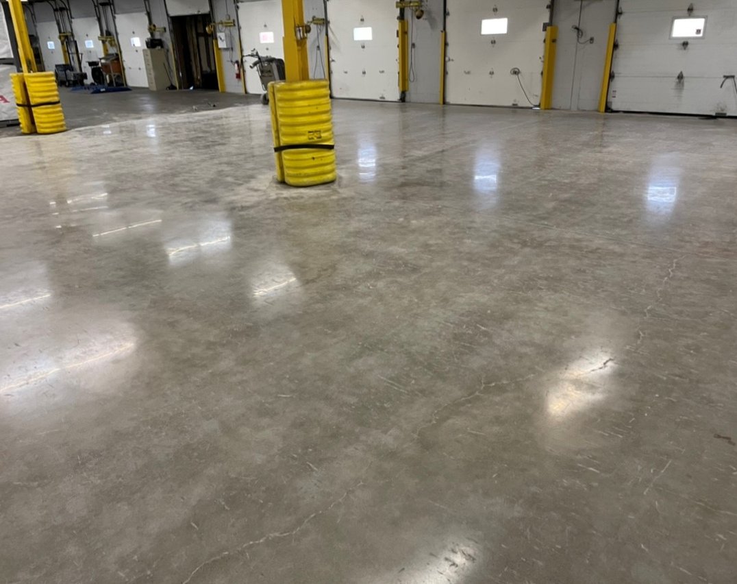 Toronto warehouse with yellow beams and polished concrete floors after completion